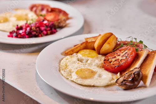 Tasty decorated beautiful appetizing dish on plate for dinner, copy space for restaurant, cafe. eggs, potatoes, vegetables. flat lay