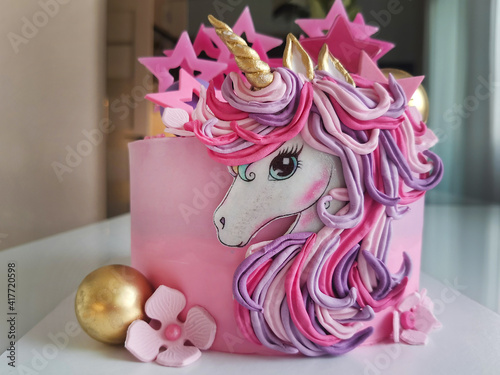 The concept of a festive dessert for children on their birthday in the form of a fantastic unicorn