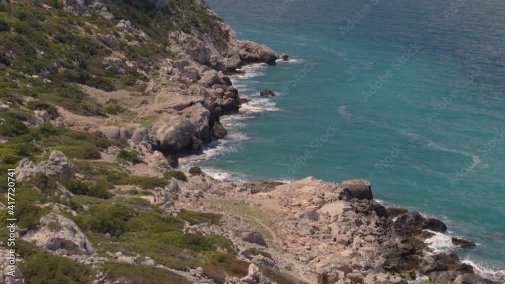Aerial Tilt Down from Lighthouse Near Loutraki to Cliffs on the Blue Ionian Sea Aerial Tilt Down from Lighthouse Near Loutraki to Cliffs on the Blue Ionian Sea