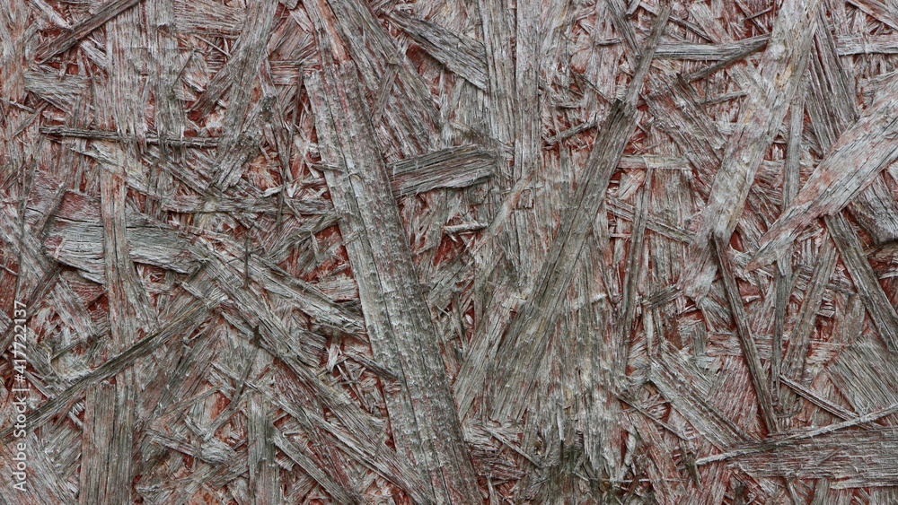 An old and damaged chipboard surface