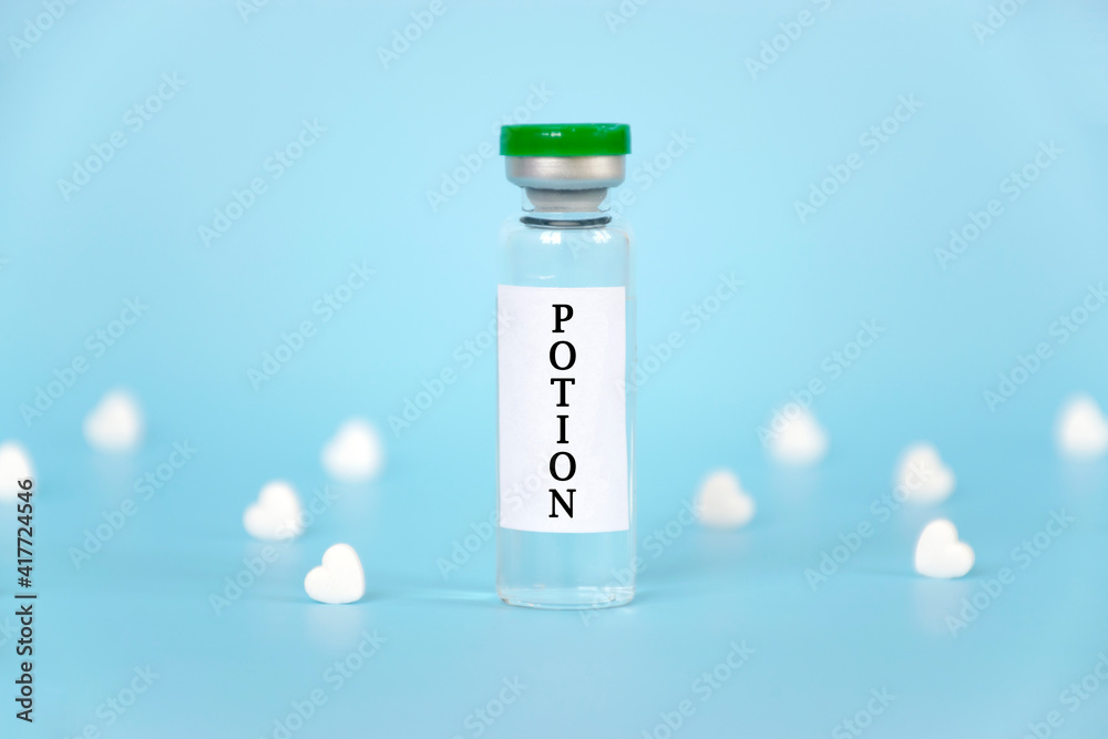Medical vial with Potion word and many white hearts on blue background. Medical vial with Potion word and many white hearts on blue background.