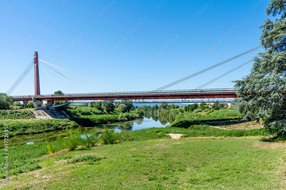 Indiano Bridge, the first earth-anchored cable-stayed bridge in the world, across the Arno River in Florence near the Indian Monument in the Cascine monumental park, Florence, Tuscany, Italy