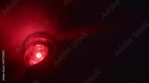 Emergency rotating alarm red light at night. photo
