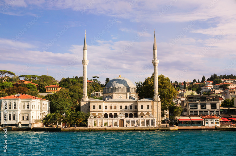 View on the bank of Bosporus Strait with Beylerbeyi Hamid-i Evvel Mosque, baroque styled two minaret mosque in Beylerbeyi neighborhood of Uskudar municipality of Istanbul