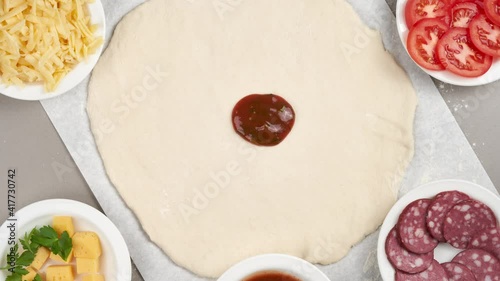 Stop motion animation - making and eating pizza with mushrooms, closeup top view.