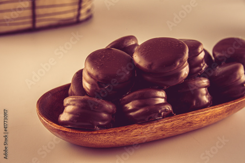 alfajores de chocolate: a traditional dessert from Latin America, Argentina and Uruguay. Vanilla cookies with dulce de leche, chocolat and coconut