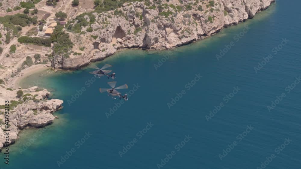 Aerial View of Helicopters Flying Over Ionian Sea Towards Bay and White Cliffs Aerial View of Helicopters Flying Over Ionian Sea Towards Bay and White Cliffs