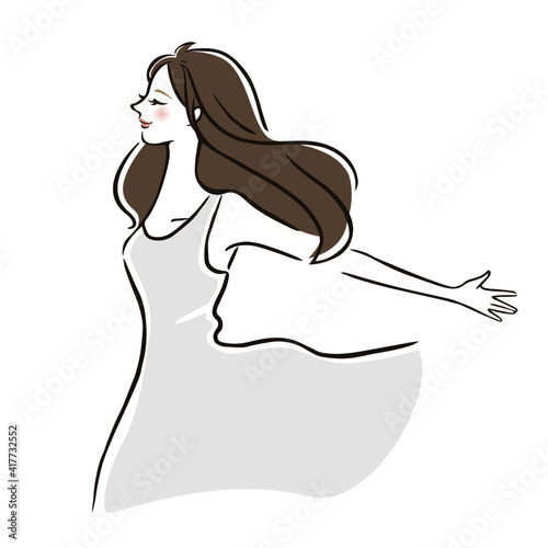 両手を広げ深呼吸する女性