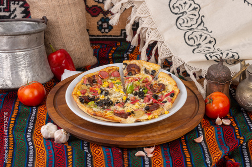 Pizza varieties ready to be served on a white plate. photo