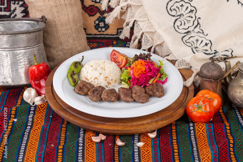 Ready-to-serve meals cooked on a white plate photo