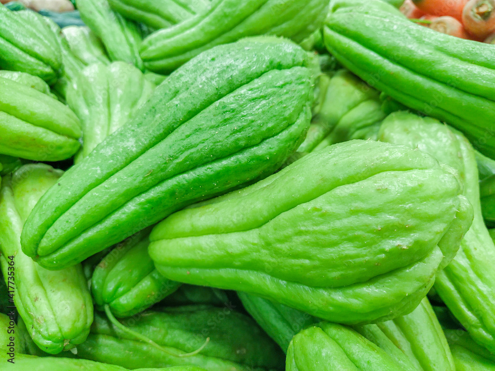 vegetable known as chayote, on a stall at an open market in Rio de Janeiro . vegetable known as chayote, on a stall at an open market in Rio de Janeiro .