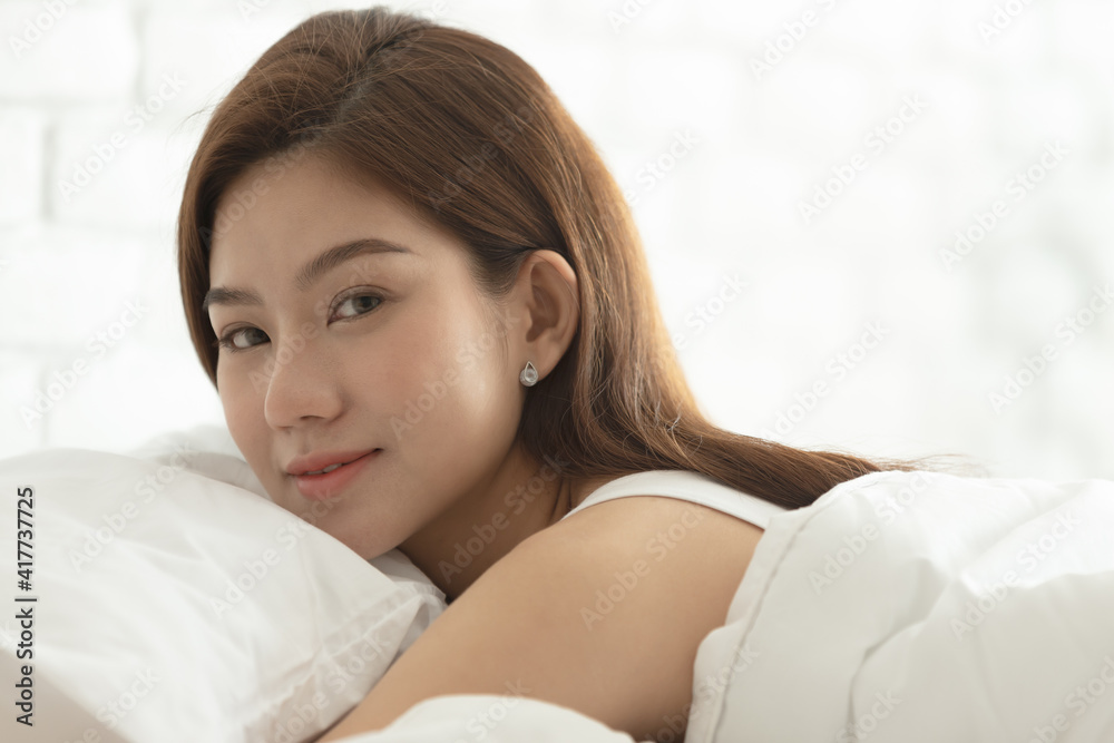Asian women sleeping and sweet dream on white bed in bedroom Asian women sleeping and sweet dream on white bed in bedroom