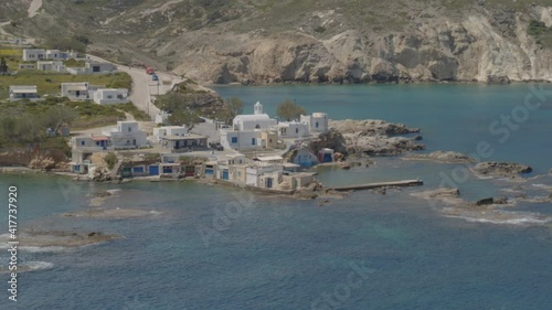 Aerial Pan Beaches on the Fishing Village of Mandrakia in Milos Greece photo