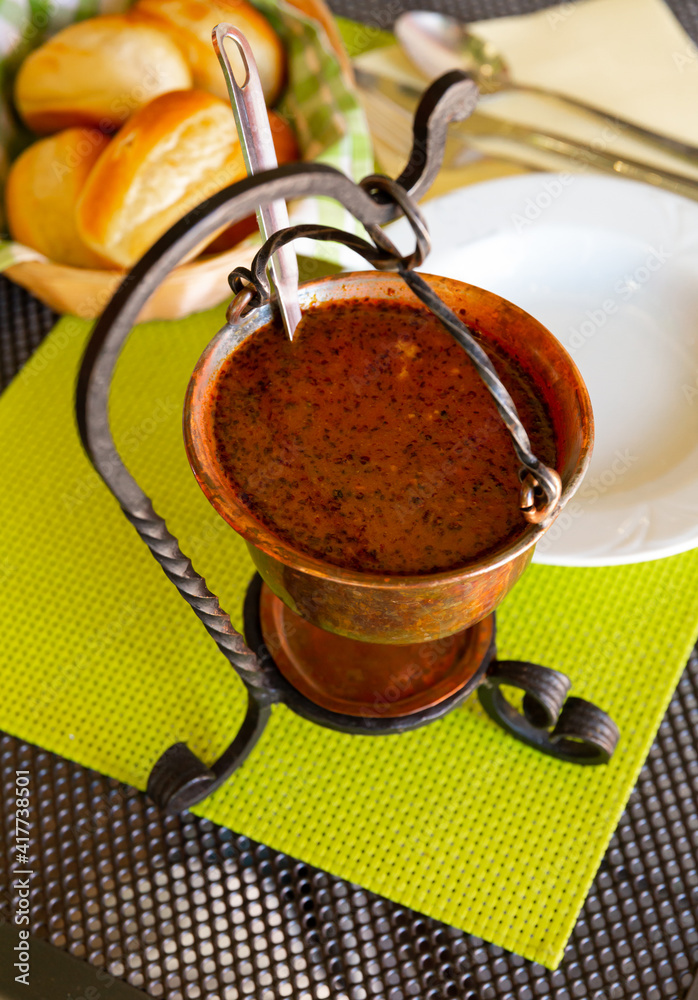 Fototapeta premium Rich Bogracs with meat, pepper and tomatoes - traditional Hungarian and Slovenian dish
