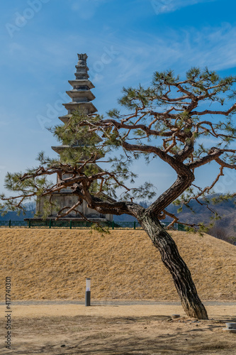 Seven story pagoda with cloudy blue sky background photo