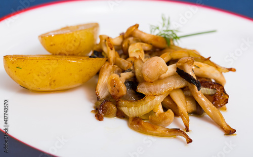 Image of tasty cooked fried baby potatoes with fried shitake mushrooms