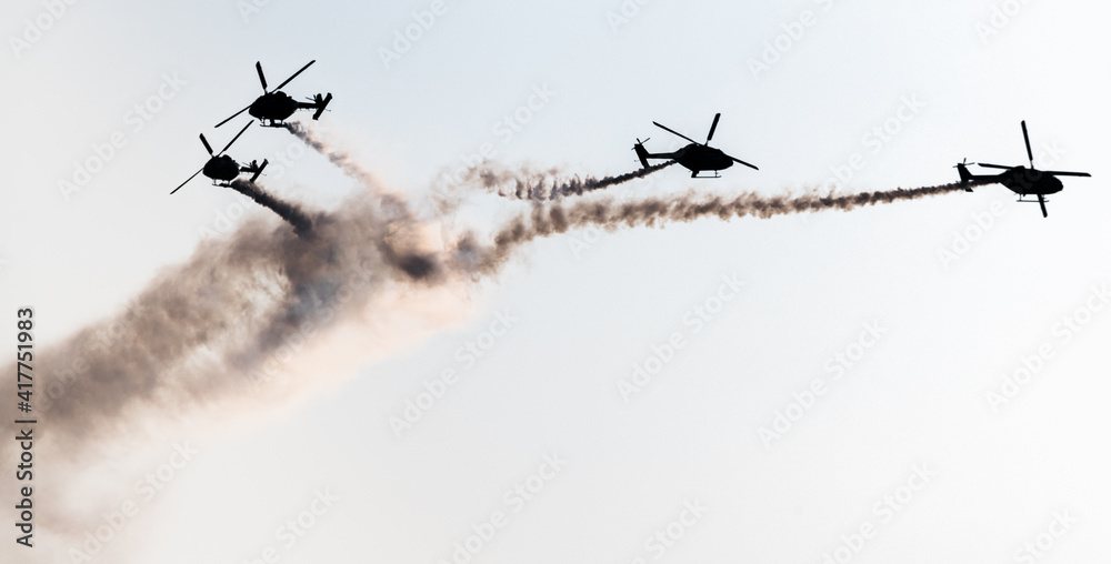 Indian Air Force Sarang helicopter air display team flying HAL Dhruv aircraft. Indian Air Force Sarang helicopter air display team flying HAL Dhruv aircraft.