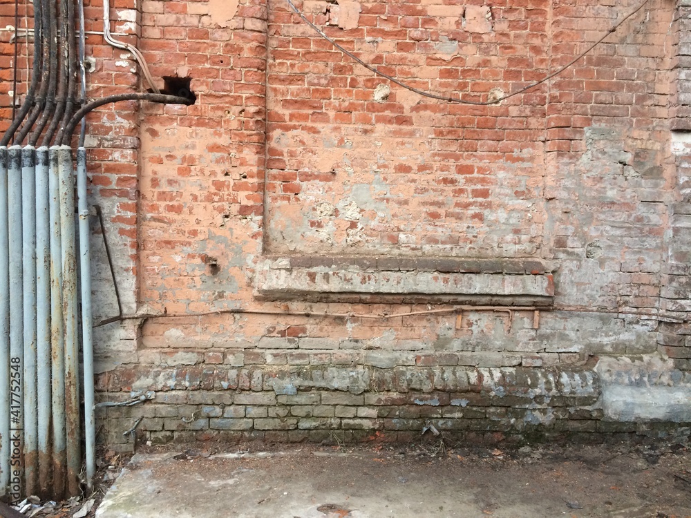 Naklejka premium brick wall texture with pipes