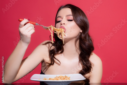 Italian pasta. Food from Italia. Spaghetti. Italian cuisine. Sexy girl eating pasta. Healthy menu.