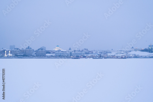 View of the skyline of the city of Kazan on a frosty winter day. Endless horizon. Foggy snowy evening