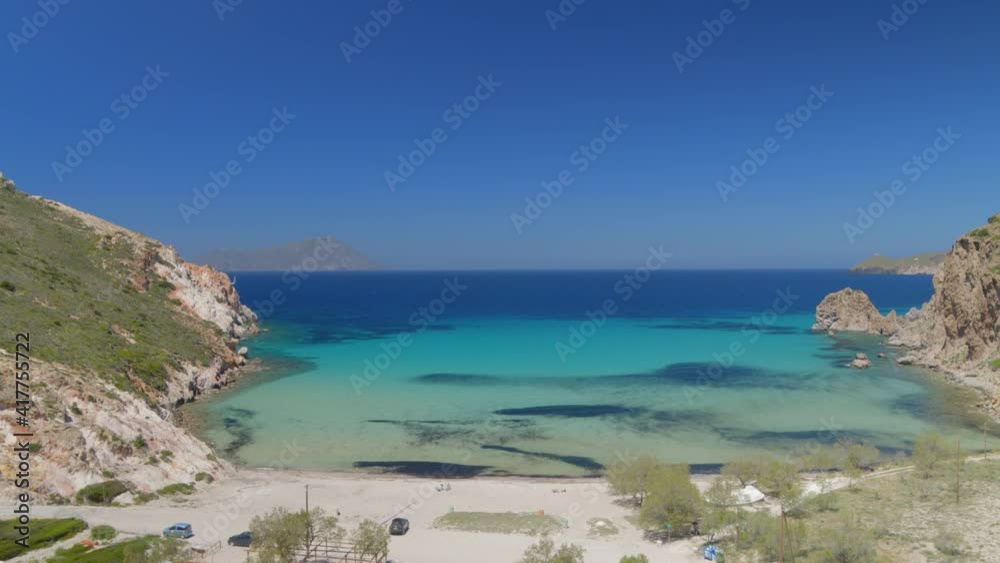Forward Aerial of a Bay Surrounded by Cliffs on the Aegean Sea in Milos Greece Forward Aerial of a Bay Surrounded by Cliffs on the Aegean Sea in Milos Greece