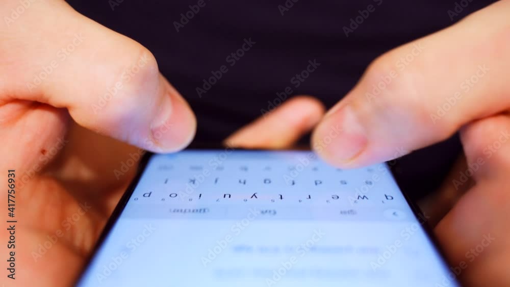 Hands typing text on smartphone close-up Hands typing text on smartphone close-up