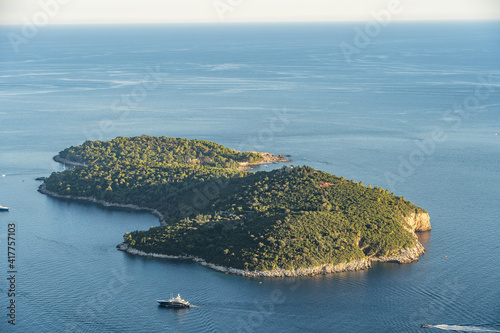 Lokrum island with green trees in Adriatic sea near Dubrovnik in Croatia summer sunset