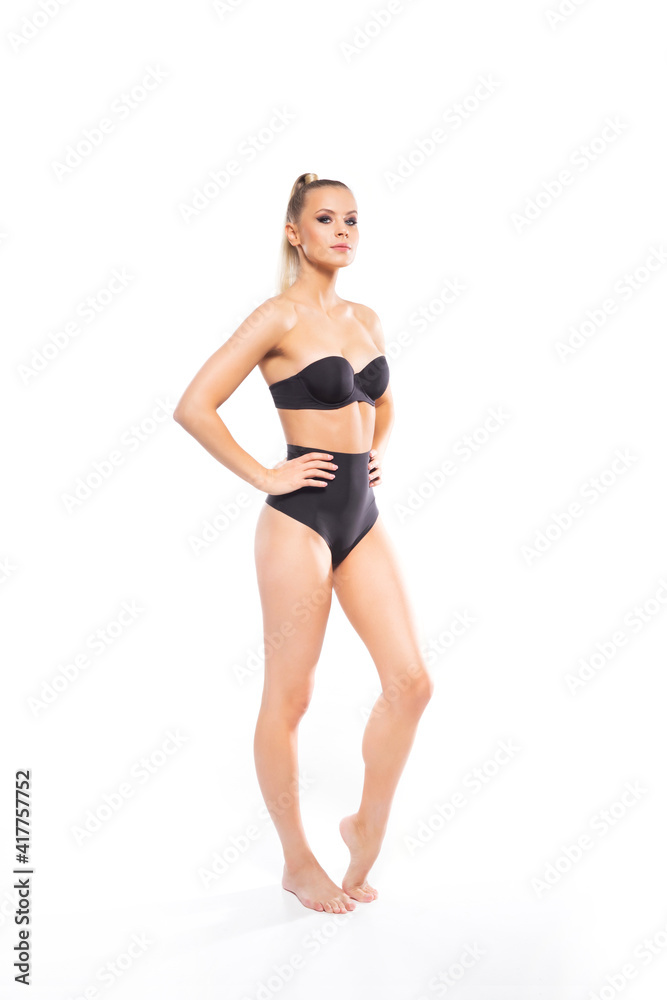 Young, fit and beautiful blond woman in white swimsuit isolated on white background. Healthcare, diet, sport and fitness. Young, fit and beautiful blond woman in white swimsuit isolated on white background. Healthcare, diet, sport and fitness.