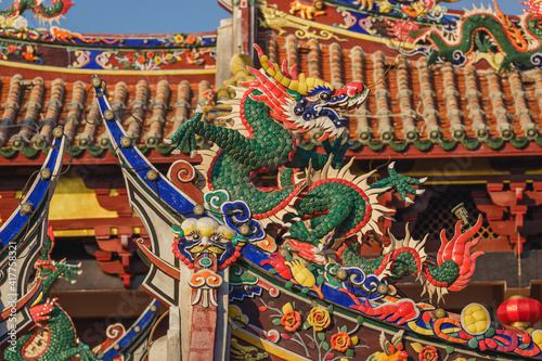 Close-up view of the architecture, traditional Chinese temple building with dragon statues in Tonghuai Temple of Guan Yu and Yue Fei on Tumen Street in Old Quanzhou city, Fujian, China