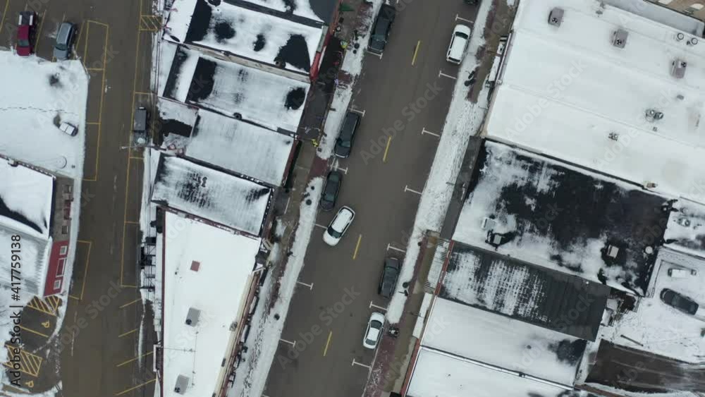 Top down ascending view of small American county town in winter season Top down ascending view of small American county town in winter season