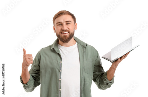 Young man with book showing...