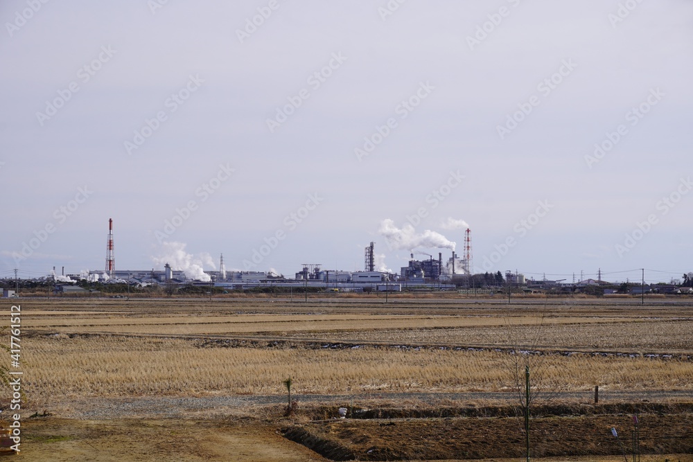 地方の工業地域の風景（冬）、宮城県岩沼市/The factory area over the rice field at rural in Tohoku, Japan.