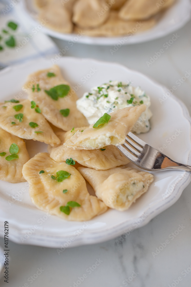 pierogi ruskie, Baked dumplings stuffed with curd cheese and potatoes 