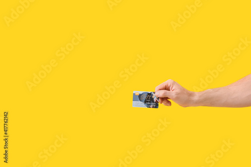 Hand with gift card on colo...