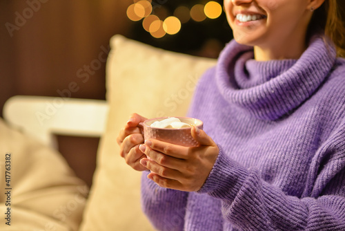 Beautiful young woman drink...