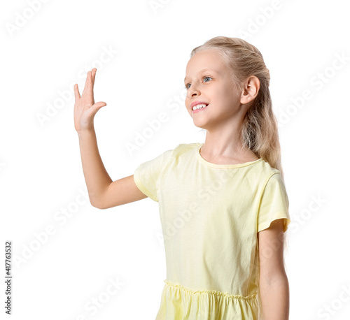 Cute little girl waving han...