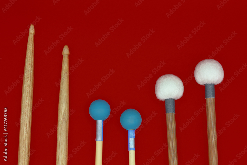 Percussion mallets set on a red background. Percussion mallets set on a red background.