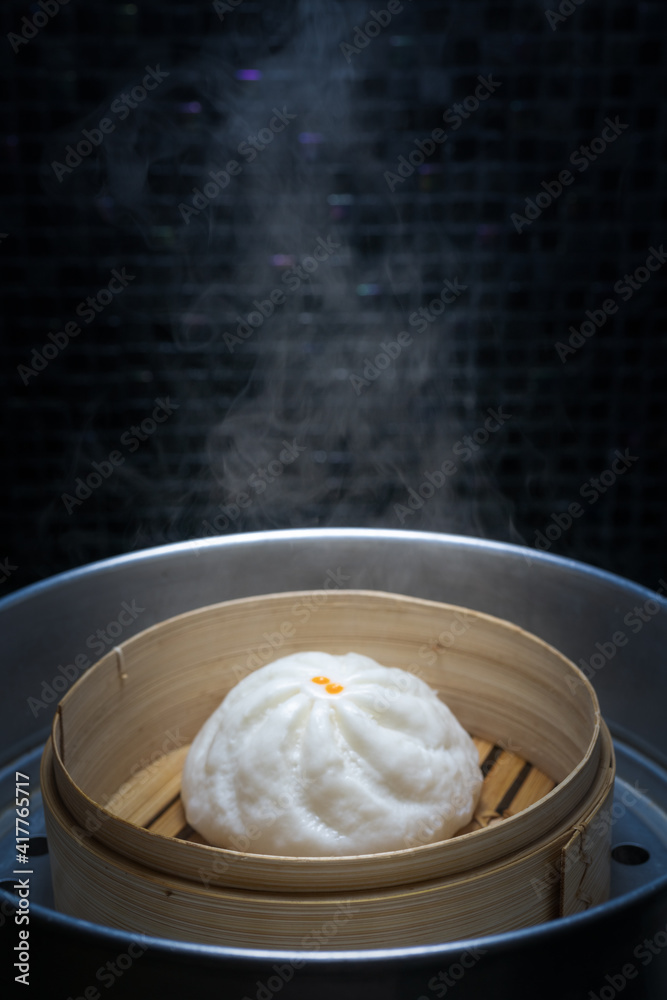 Chinese steamed meat bun in a hot oven is ready to serve and eat. Chinese steamed meat bun in a hot oven is ready to serve and eat.