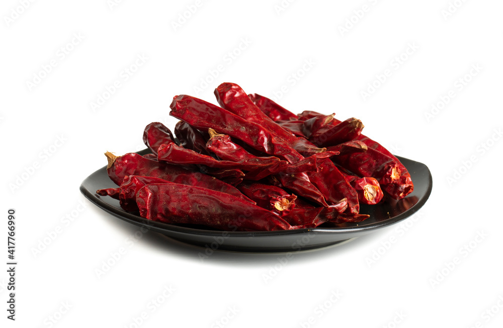 Dried Red Chili Peppers with Red Chili Powder isolated on White Background Dried Red Chili Peppers with Red Chili Powder isolated on White Background