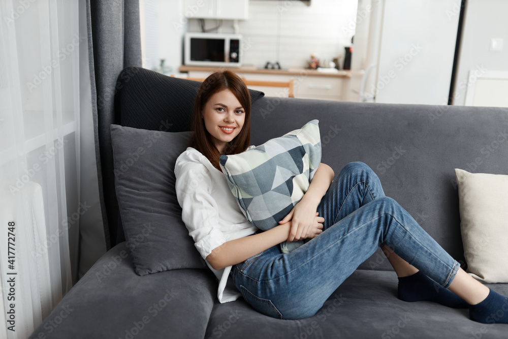 pretty woman with pillow in hands comfortable sofa pretty woman with pillow in hands comfortable sofa