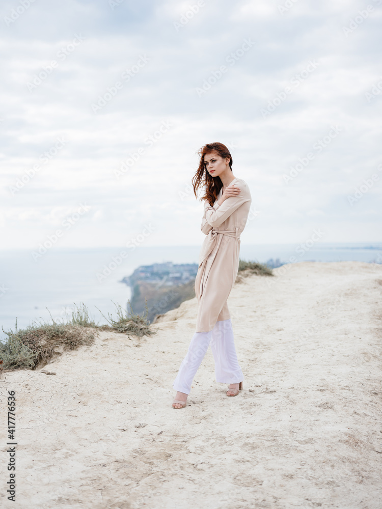 Woman wearing light clothes in full growth in nature and sand model shoes Woman wearing light clothes in full growth in nature and sand model shoes