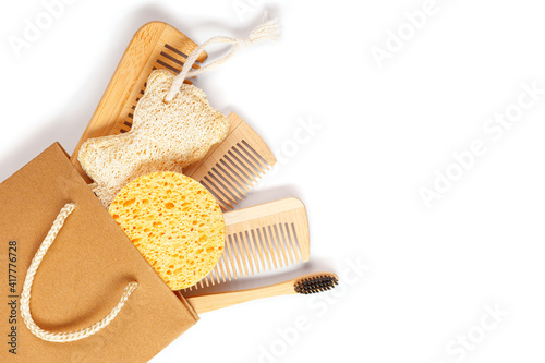 Slika na platnu a set consisting of wooden combs, a toothbrush and a washcloth in a craft packag