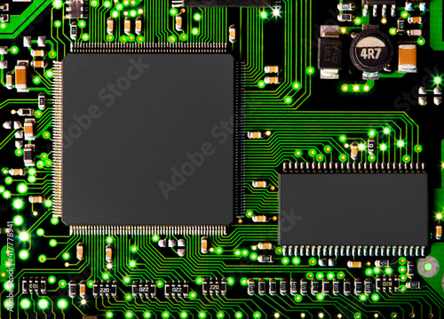 Fototapeta Naklejka Na Ścianę i Meble -  Close up of computer circuit board in green with transistors and chip