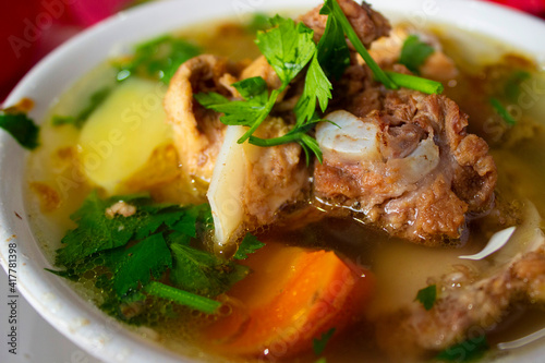sop buntut or oxtail soup or tail soup is traditional soup made from tail ox, Boiled with Spices photo