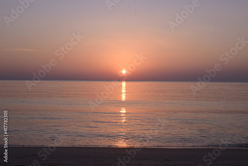sunset over the sea © Thanarat