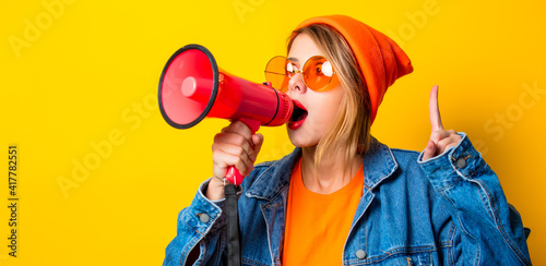 girl in jeans clothes with pink megaphone