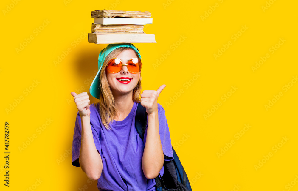 student girl with orange glasses and books