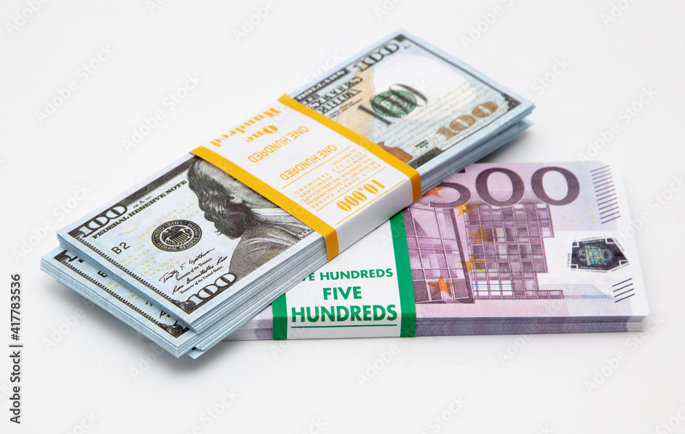 Bundle of dollars and euros on a white Bundle of dollars and euros on a white