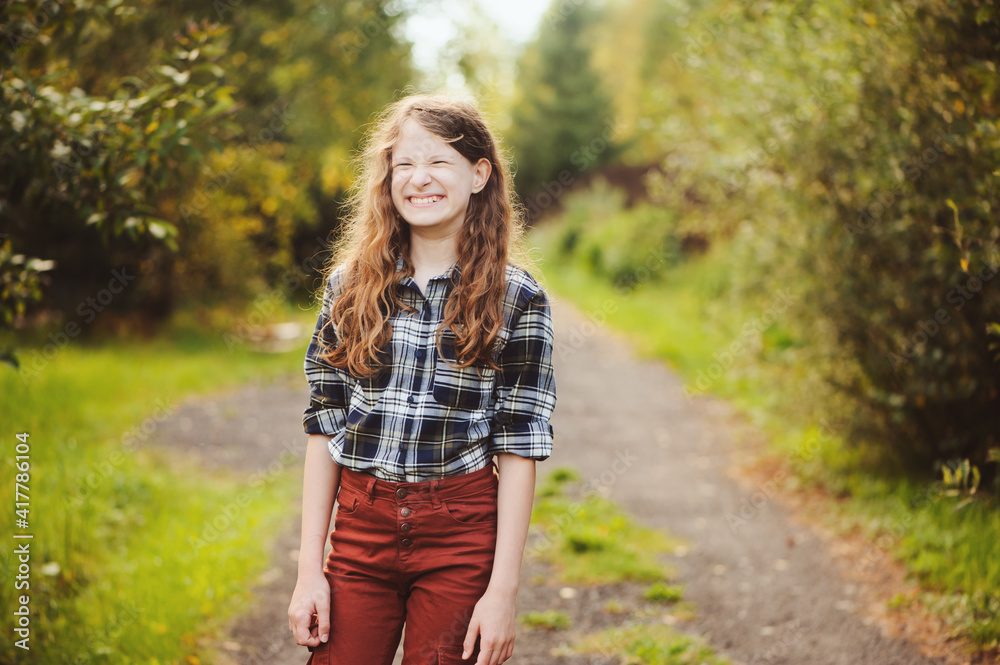 preteen 11 years old kid girl walking on summer countryside road, enjoying vacations outdoor preteen 11 years old kid girl walking on summer countryside road, enjoying vacations outdoor