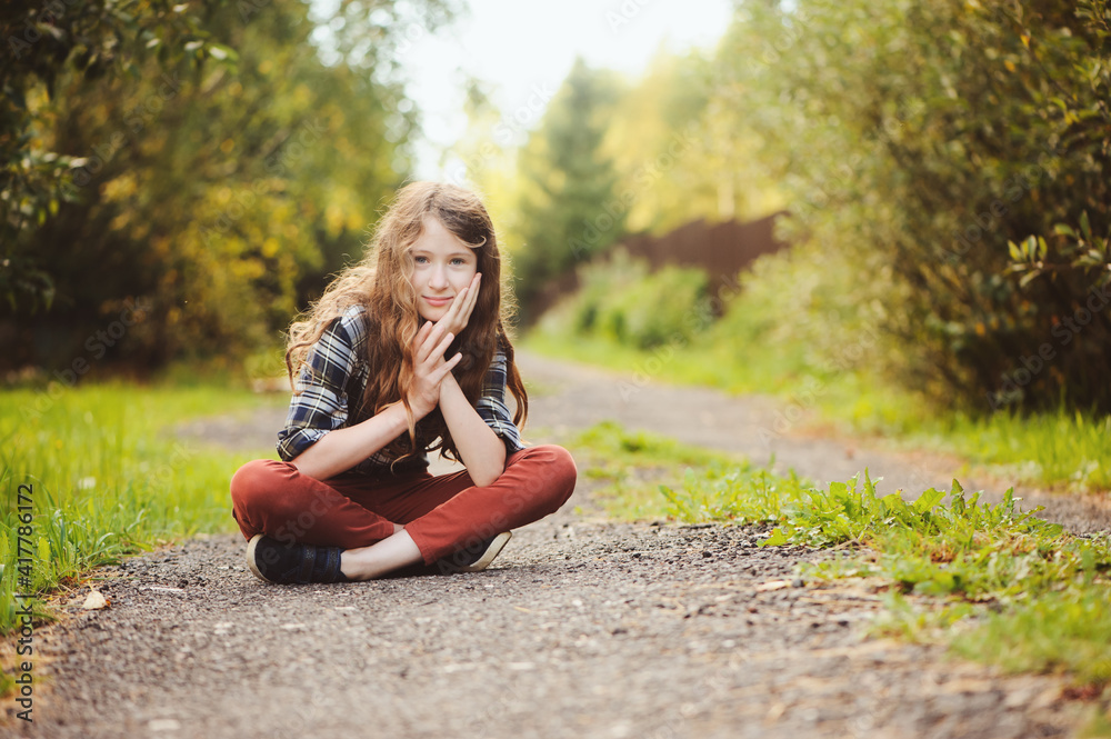 preteen 11 years old kid girl walking on summer countryside road, enjoying vacations outdoor preteen 11 years old kid girl walking on summer countryside road, enjoying vacations outdoor
